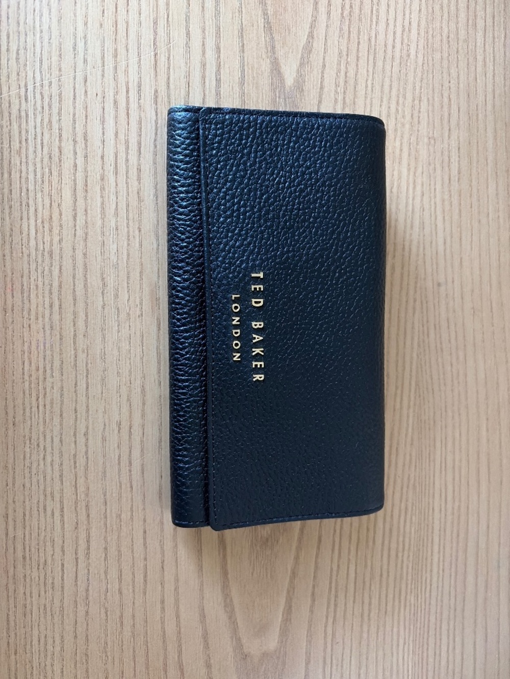 A black Ted Baker side bag